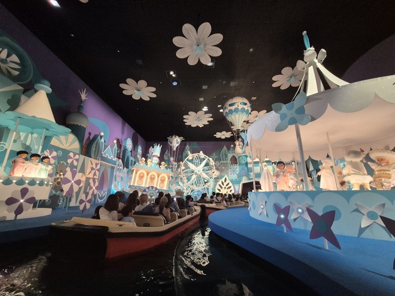 A colorful Tokyo Disneyland attraction scene with boats and lights