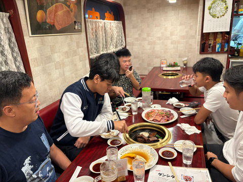 YIS students sharing yakiniku dinner in Tokyo
