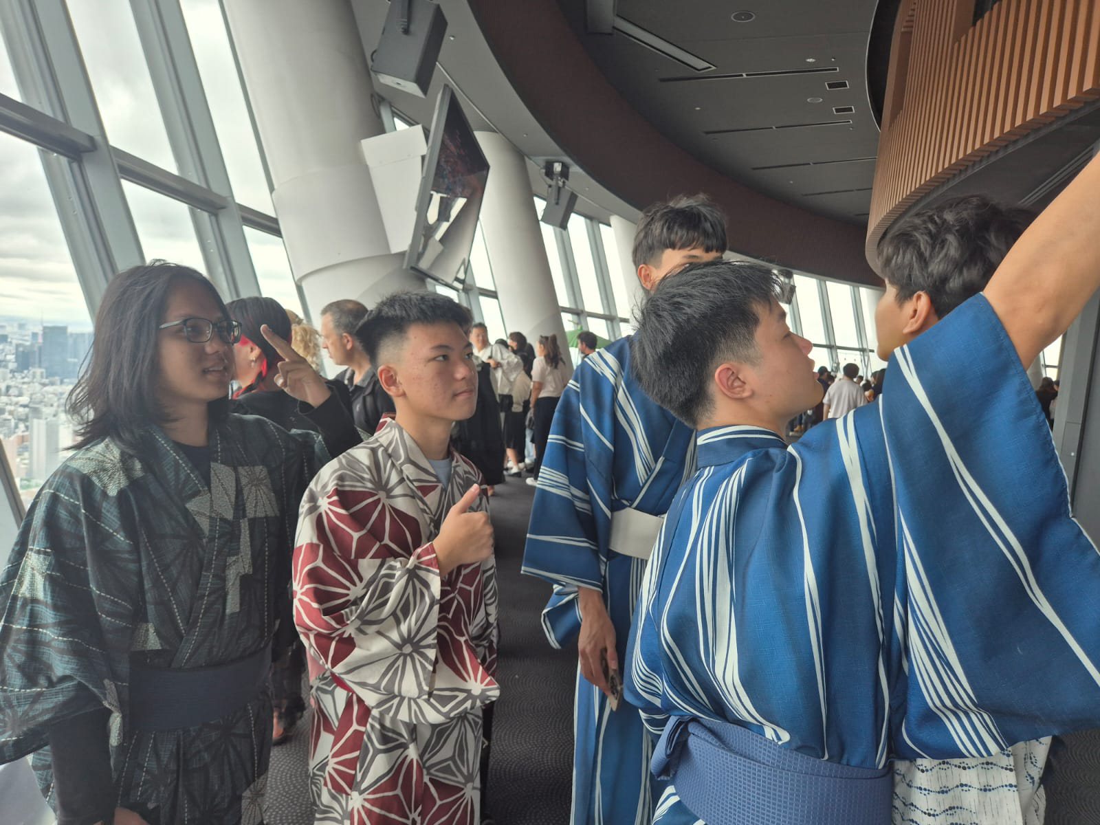 YIS student explaining something to classmates inside Tokyo Skytree